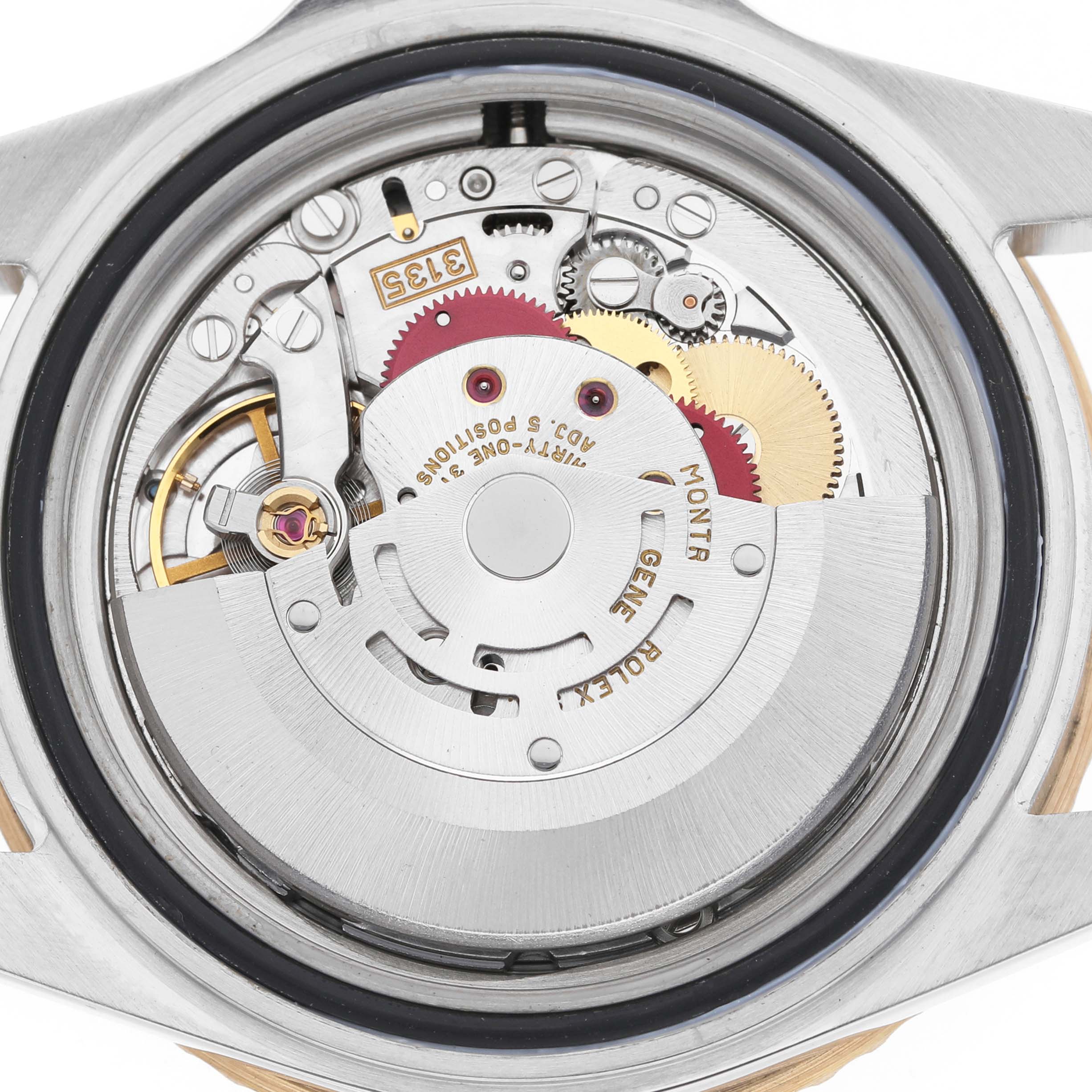 The image shows the back view of a Rolex Submariner 16613 Men's Steel and Gold (two tone) Blue Dial, revealing its internal movement and components.