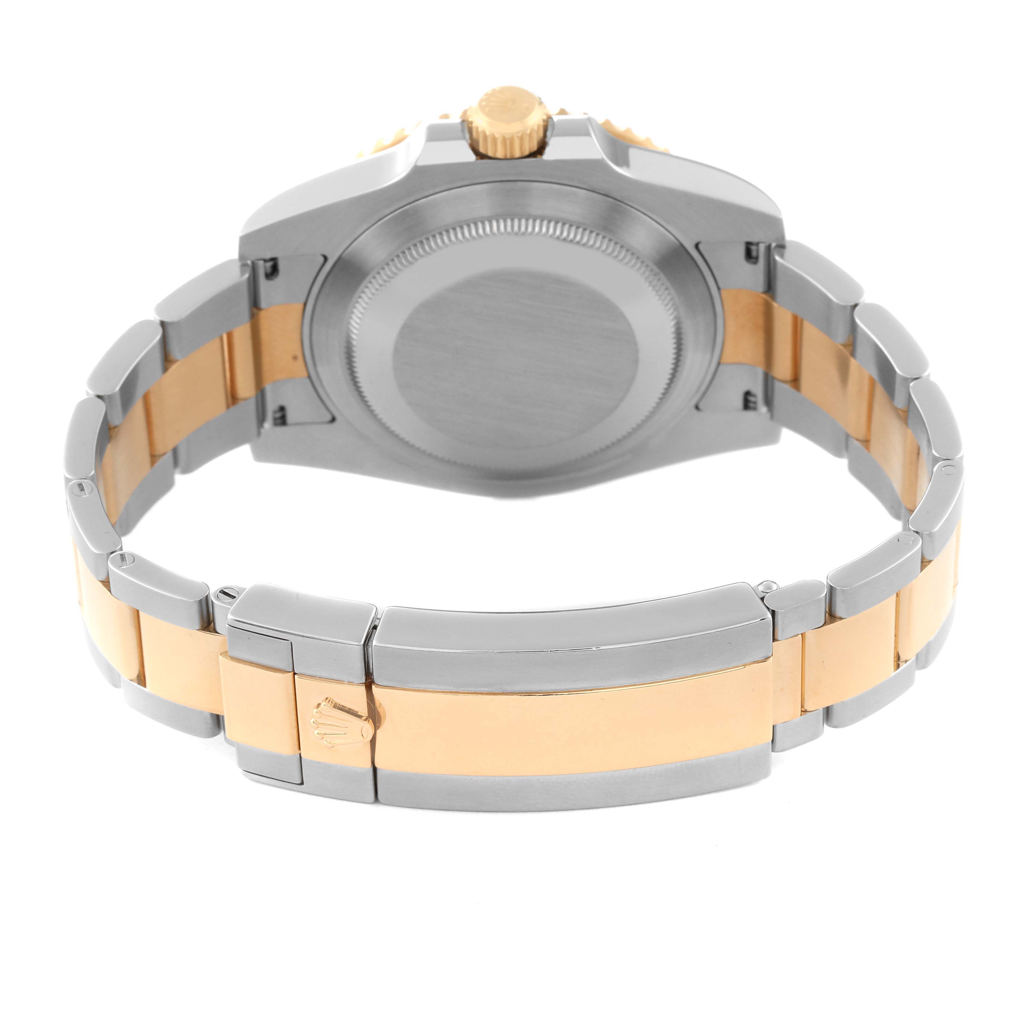 The image shows the back case and two-tone bracelet of a Rolex Submariner 116613LB Men's Steel and Gold (two tone) Blue Dial 116613LB Men's Steel and Gold (two tone) Blue Dial watch.