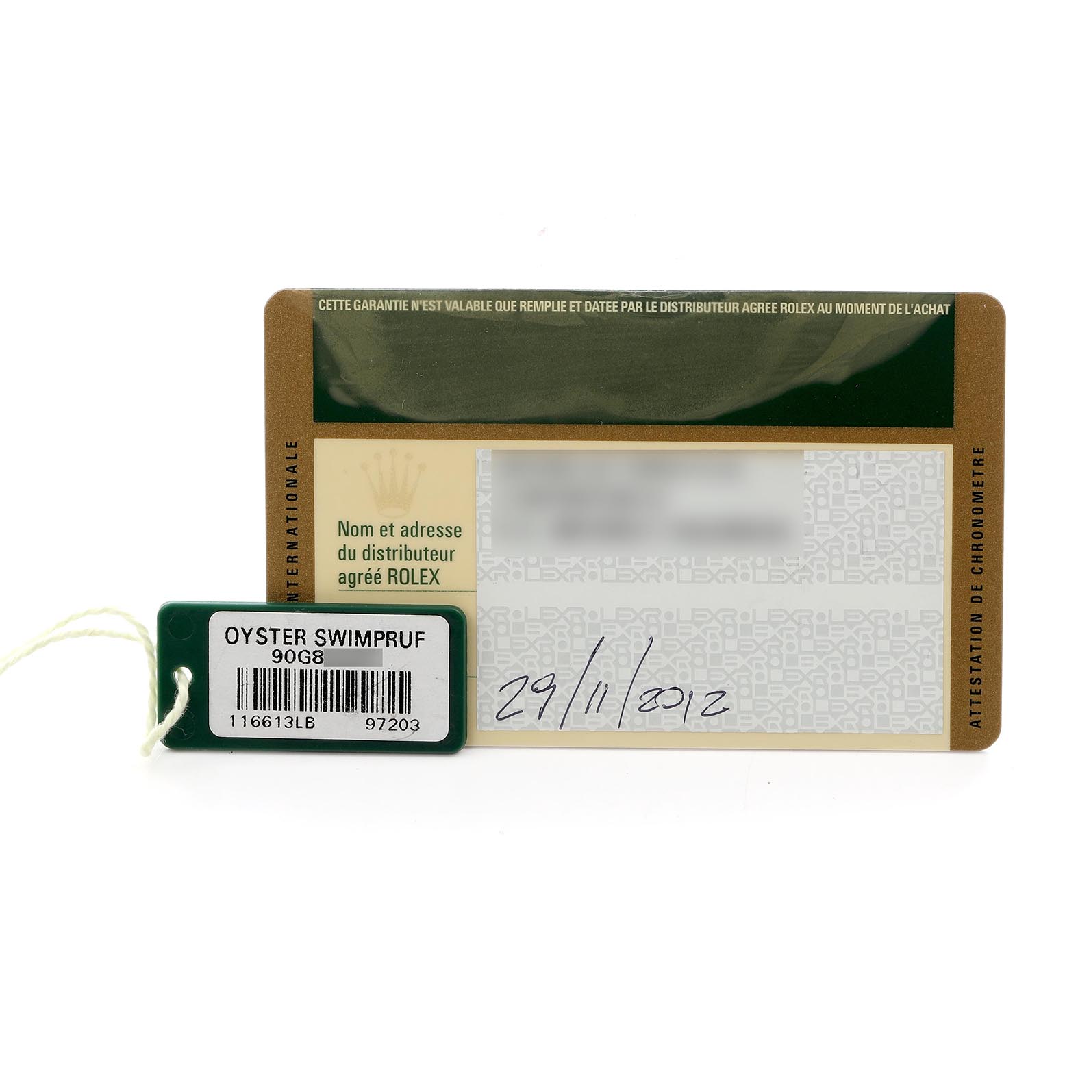 The image shows a warranty card and tag for a Rolex Submariner 116613LB Men's Steel and Gold (two tone) Blue Dial 116613LB Men's Steel and Gold (two tone) Blue Dial, featuring the model number and purchase date.
