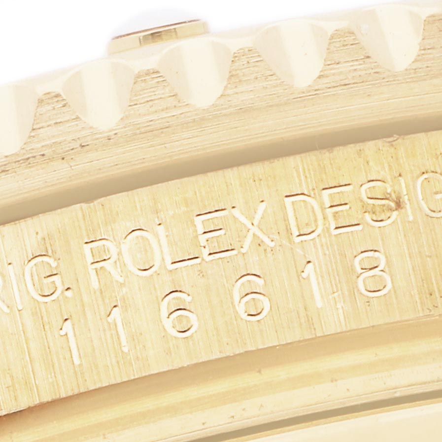 The image shows a close-up of the bezel edge and engraved model number of the Rolex Submariner 116618LB Men's Yellow Gold Blue Dial 116618LB Men's Yellow Gold Blue Dial.