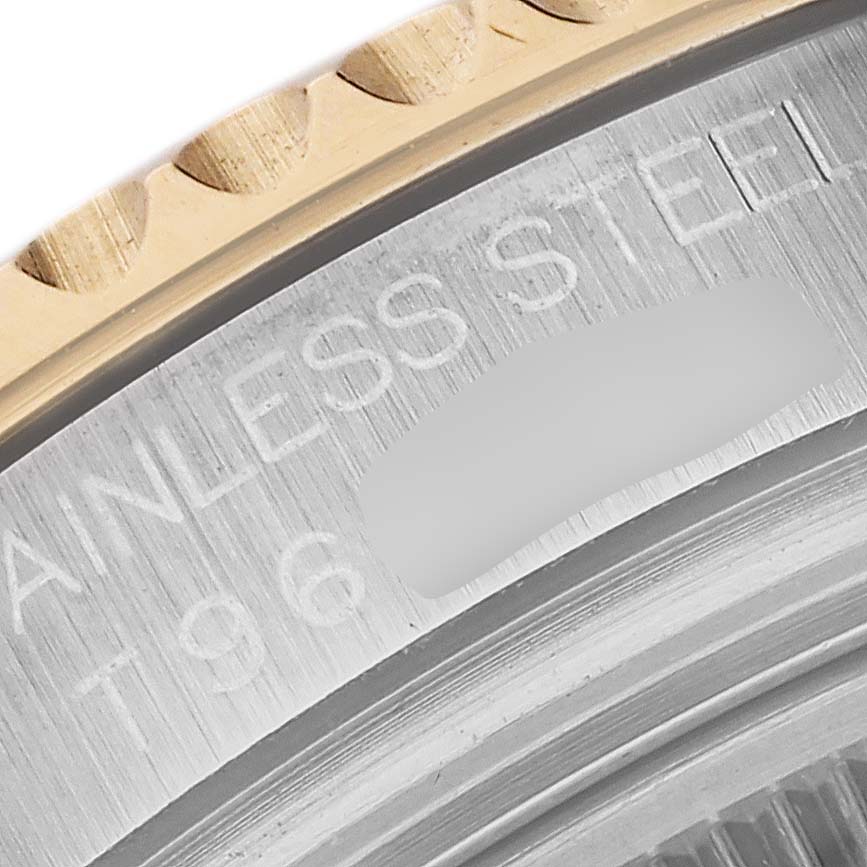 This close-up image shows the bezel edge and engraved text on the case back of the Rolex Yacht-Master 68623 Men's Steel and Gold (two tone) Grey Dial 68623 Men's Steel and Gold (two tone) Grey Dial watch.