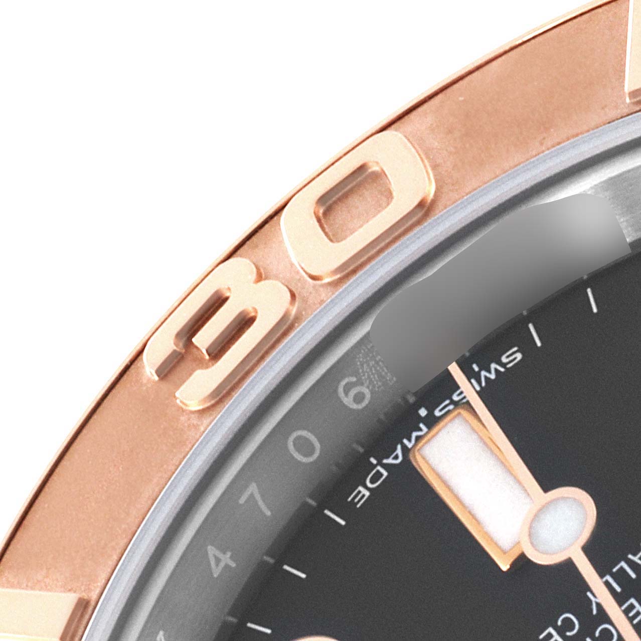 The image shows a close-up of the bezel and part of the dial of a Rolex Yacht-Master 116621 Men's Steel and Gold (two tone) Black Dial 116621 Men's Steel and Gold (two tone) Black Dial watch.