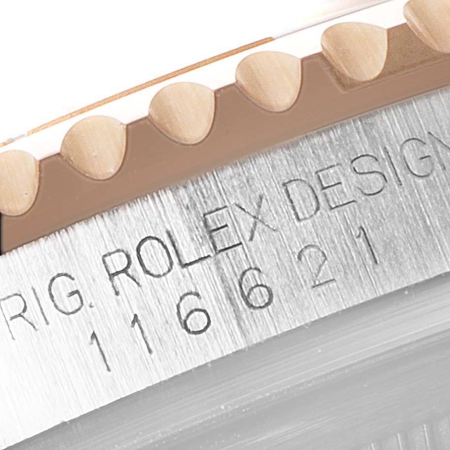 This image shows a close-up of the bezel and case of a Rolex Yacht-Master 116621 Men's Steel and Gold (two tone) Black Dial 116621 Men's Steel and Gold (two tone) Black Dial watch, focusing on the model number and brand engraving.
