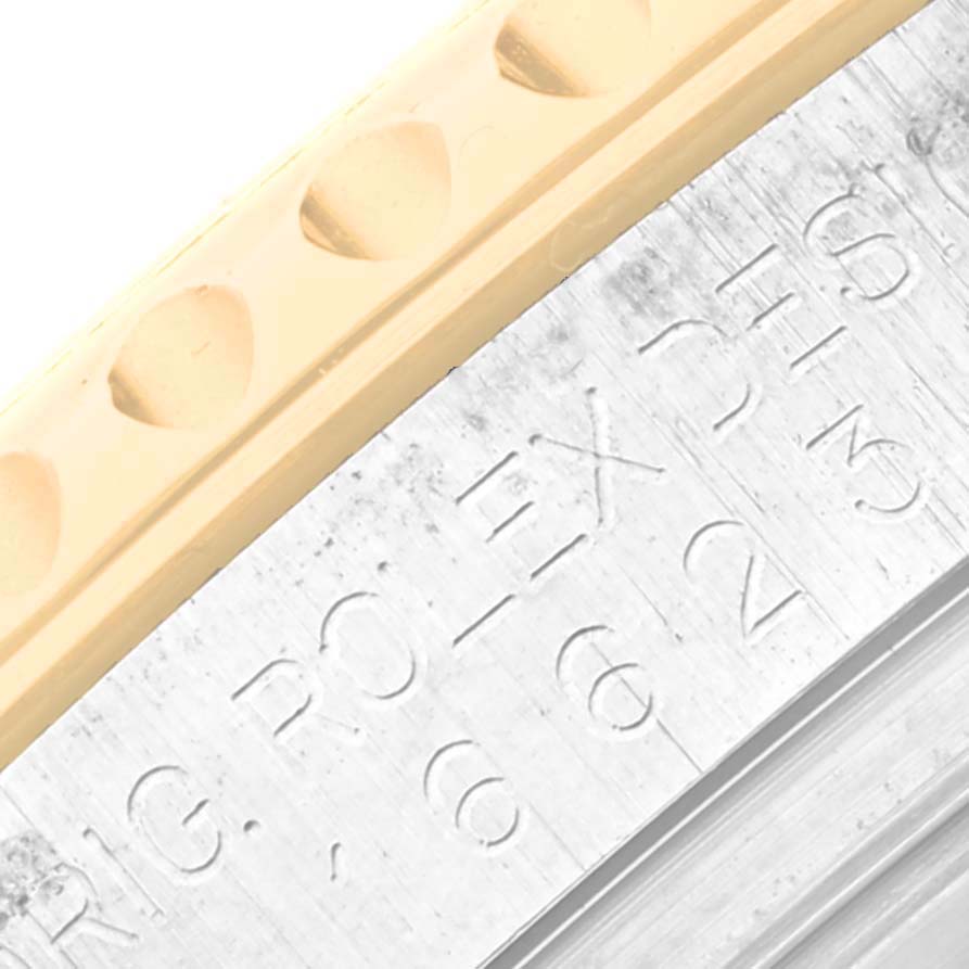 This image shows a close-up of the bezel and part of the engravings on the Rolex Yacht-Master 16623 Men's Steel and Gold (two tone) Mother of Pearl Dial 16623 Men's Steel and Gold (two tone) Mother of Pearl Dial watch.