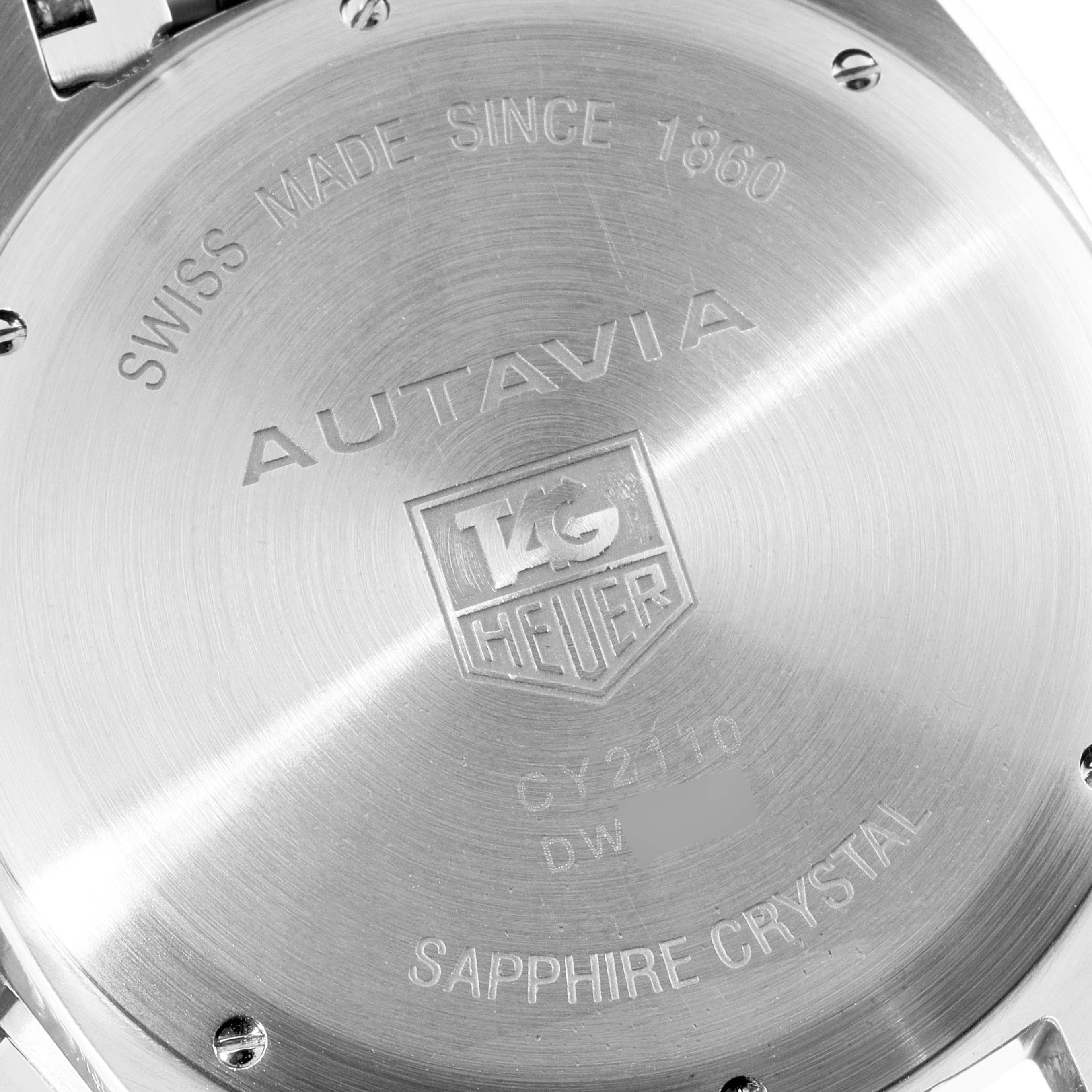 This image shows the back case of a Tag Heuer Autavia CY2110 Men's Stainless Steel White Dial CY2110 Men's Stainless Steel White Dial watch, displaying engravings and brand details.
