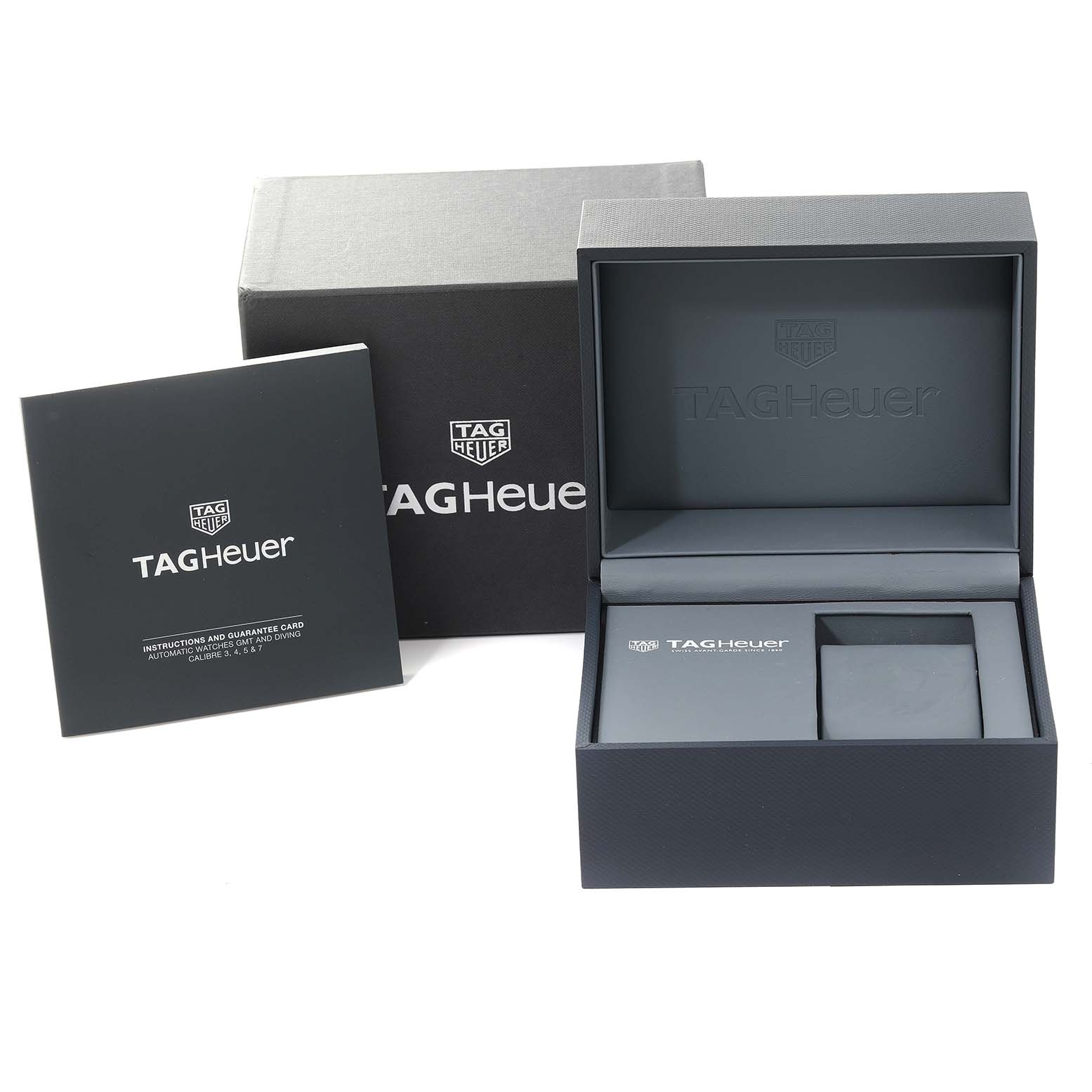 The image shows the packaging and accessories of a Tag Heuer Link CJF1314 Women's Stainless Steel Mother of Pearl Dial CJF1314 Women's Stainless Steel Mother of Pearl Dial model watch, including its box and instruction manual.