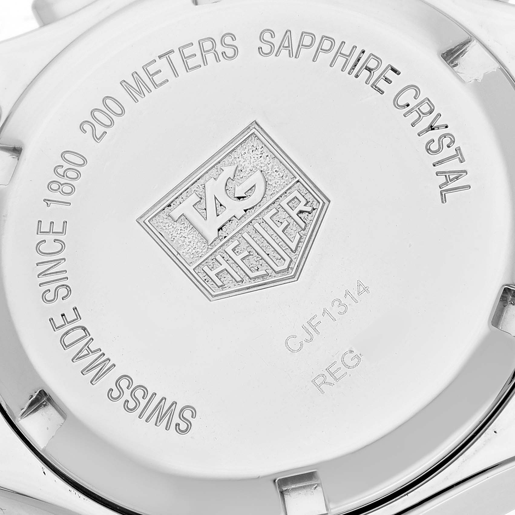 The image shows the back cover of a Tag Heuer Link CJF1314 Women's Stainless Steel Mother of Pearl Dial CJF1314 Women's Stainless Steel Mother of Pearl Dial model watch, displaying the brand logo and specifications.