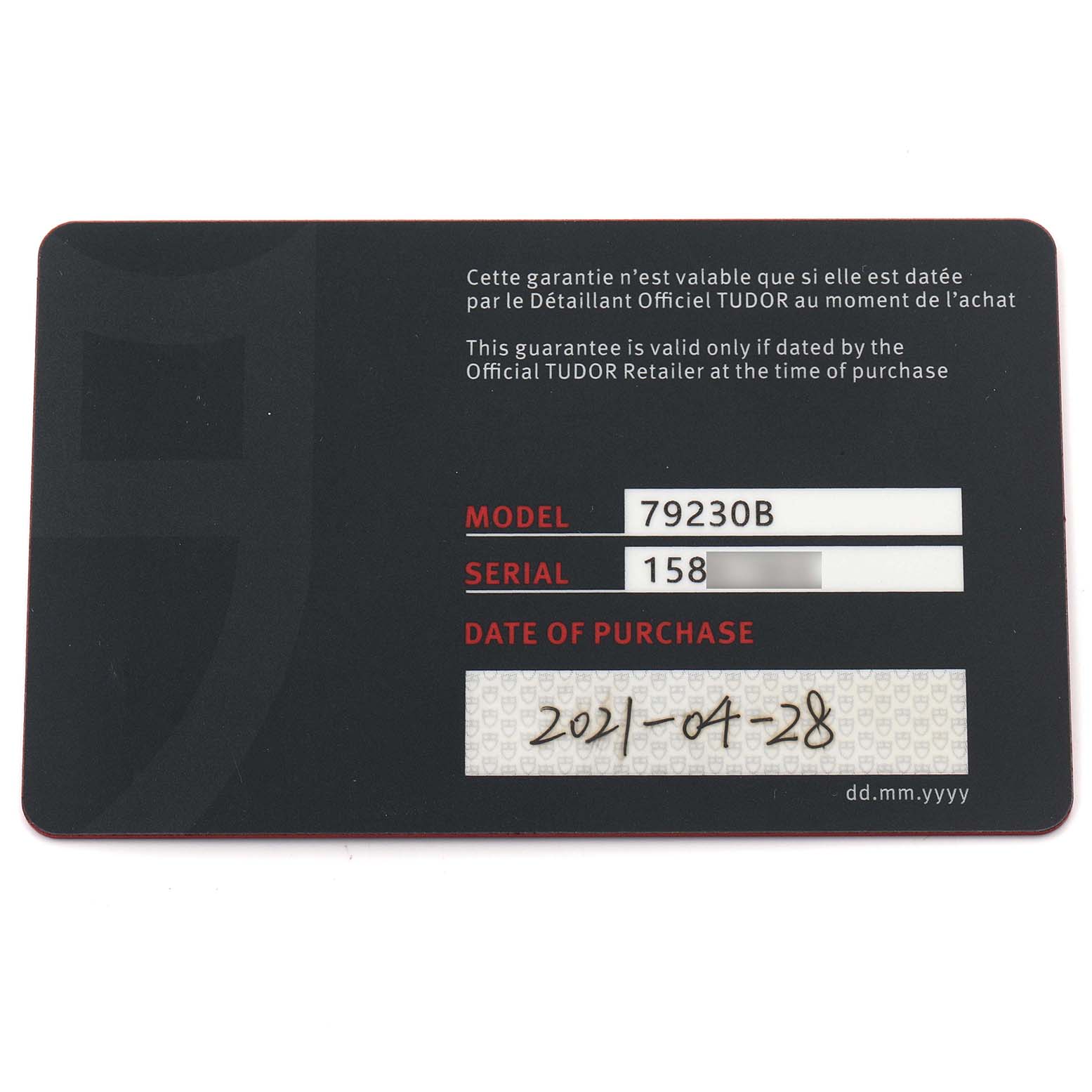 The image shows a flat view of a warranty card for a Tudor Heritage Black Bay 79230B Men's Stainless Steel Black Dial 79230B Men's Stainless Steel Black Dial watch, listing model and serial numbers.