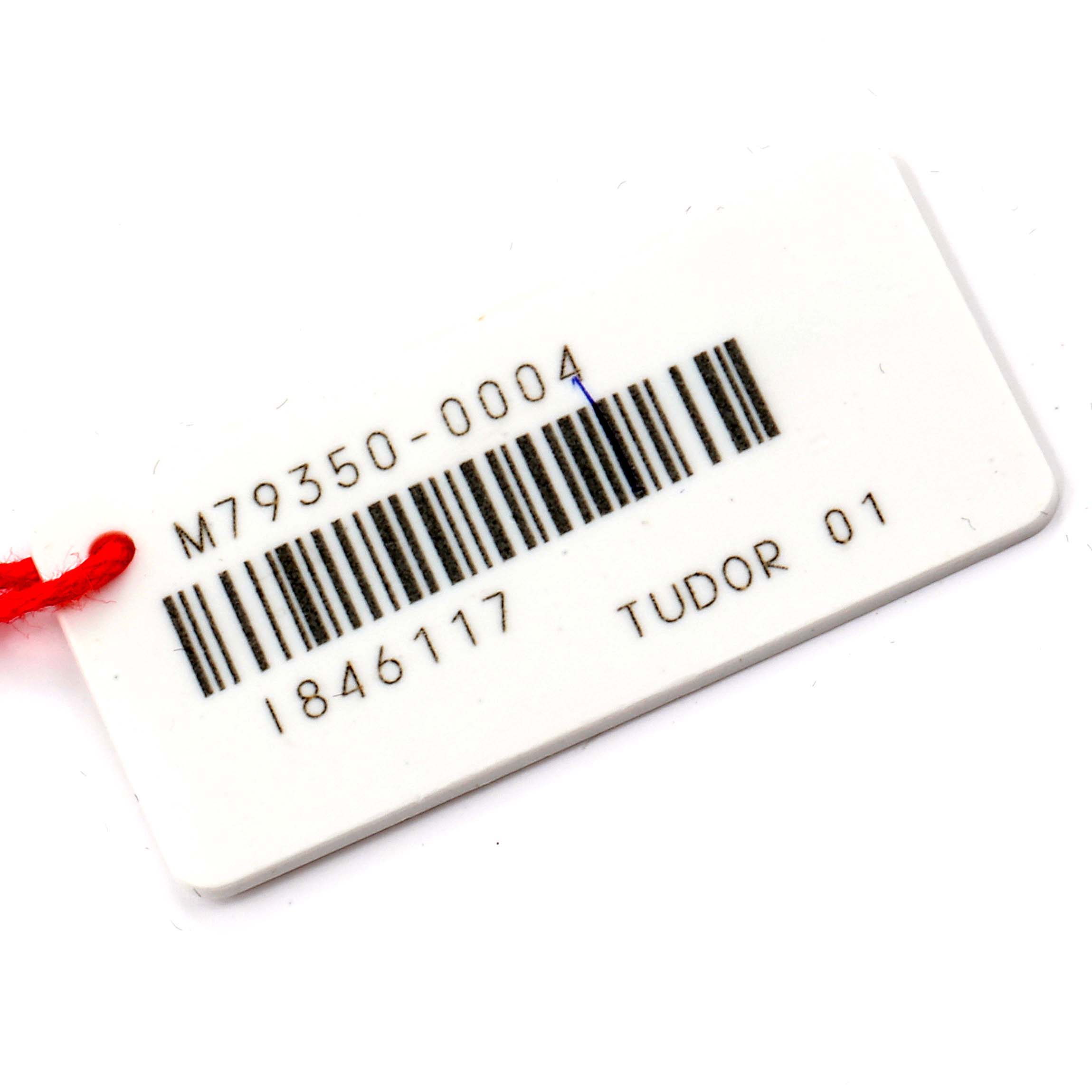 This image shows the tag with the barcode and model number for the Tudor Heritage Black Bay 79350 Men's Stainless Steel Black Dial 79350 Men's Stainless Steel Black Dial watch.