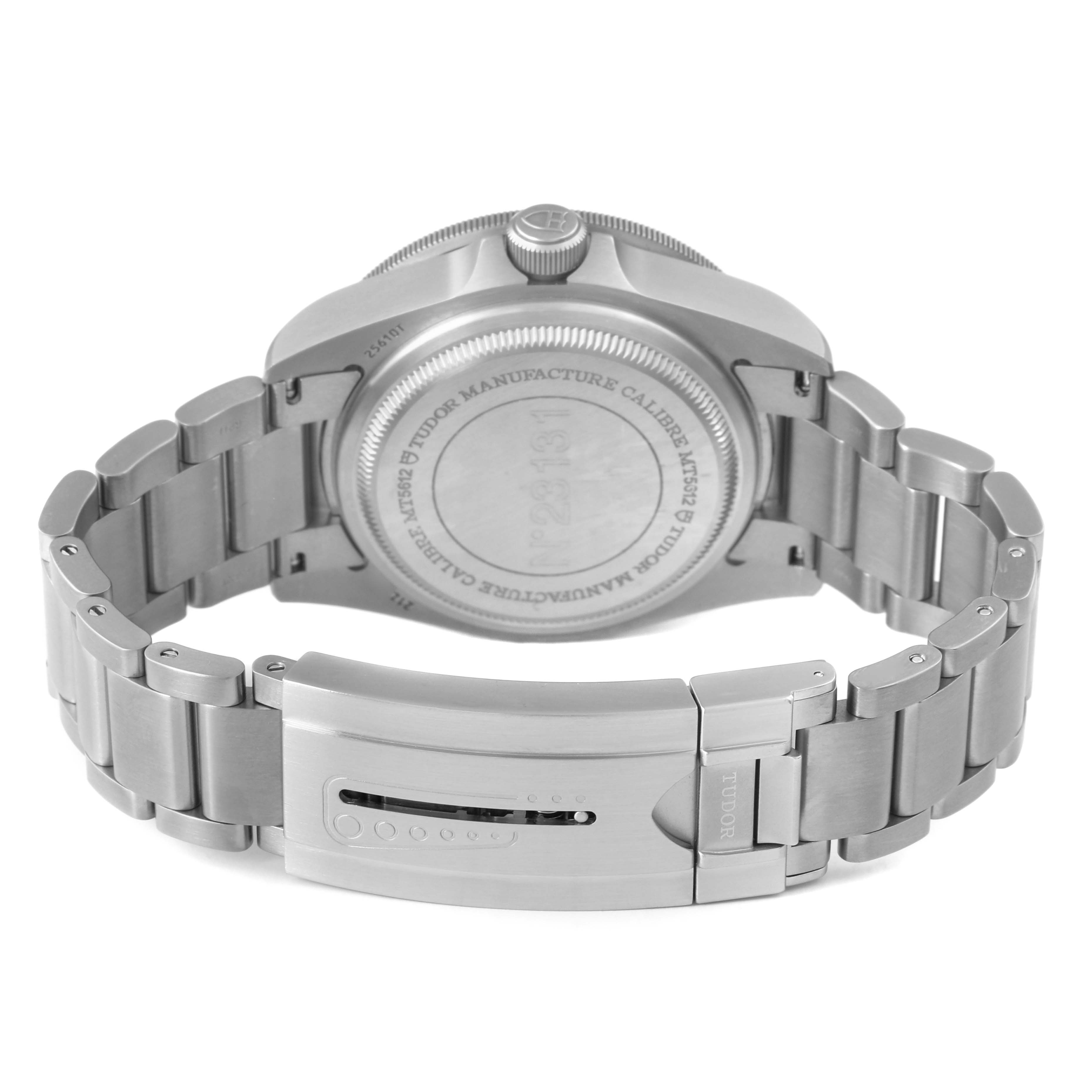 The image shows the back of a Tudor Pelagos M25610TNL Men's Titanium Black Dial watch, highlighting the clasp and bracelet from a slightly raised rear angle.