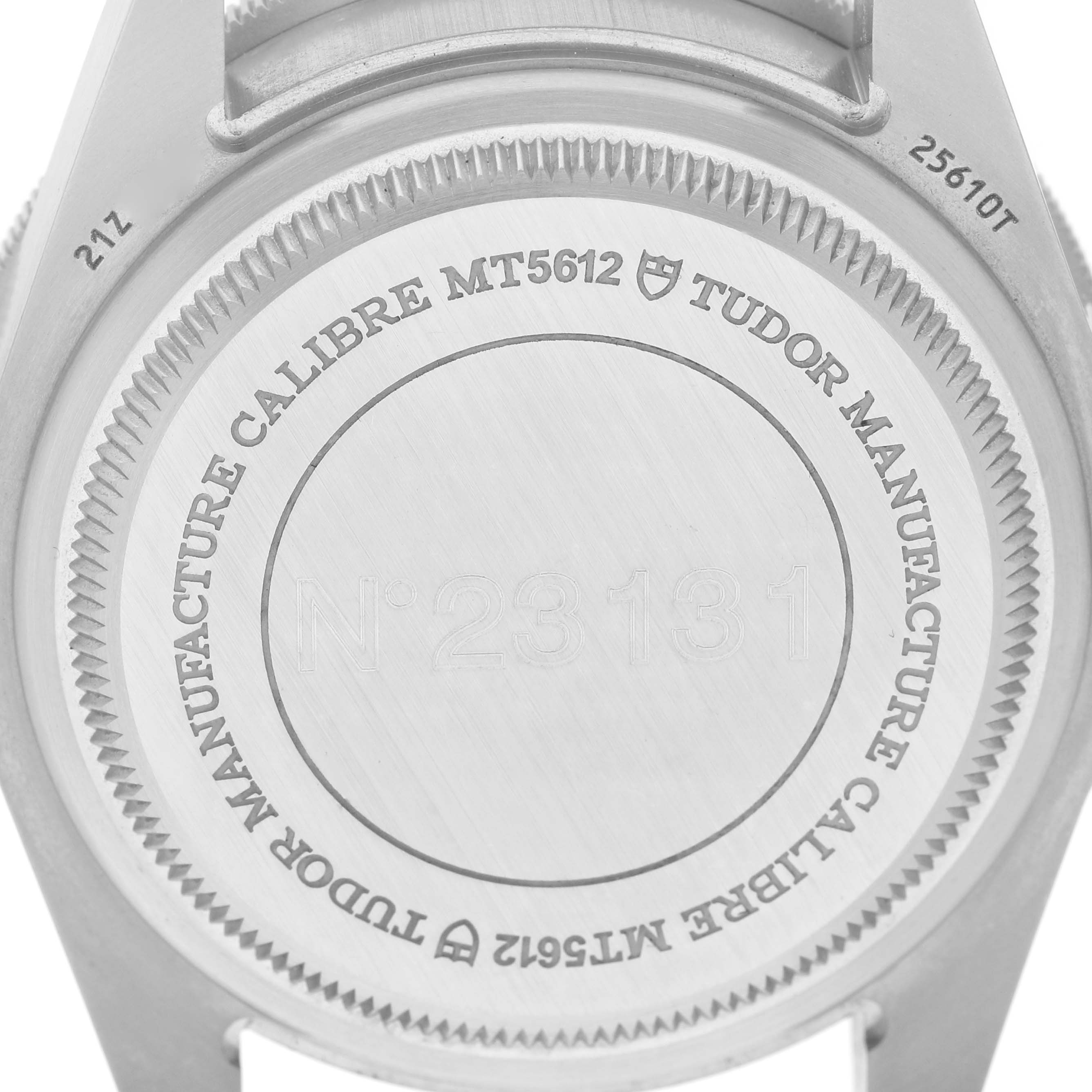 The image shows the back case of a Tudor Pelagos M25610TNL Men's Titanium Black Dial watch, highlighting the engraving and model details.