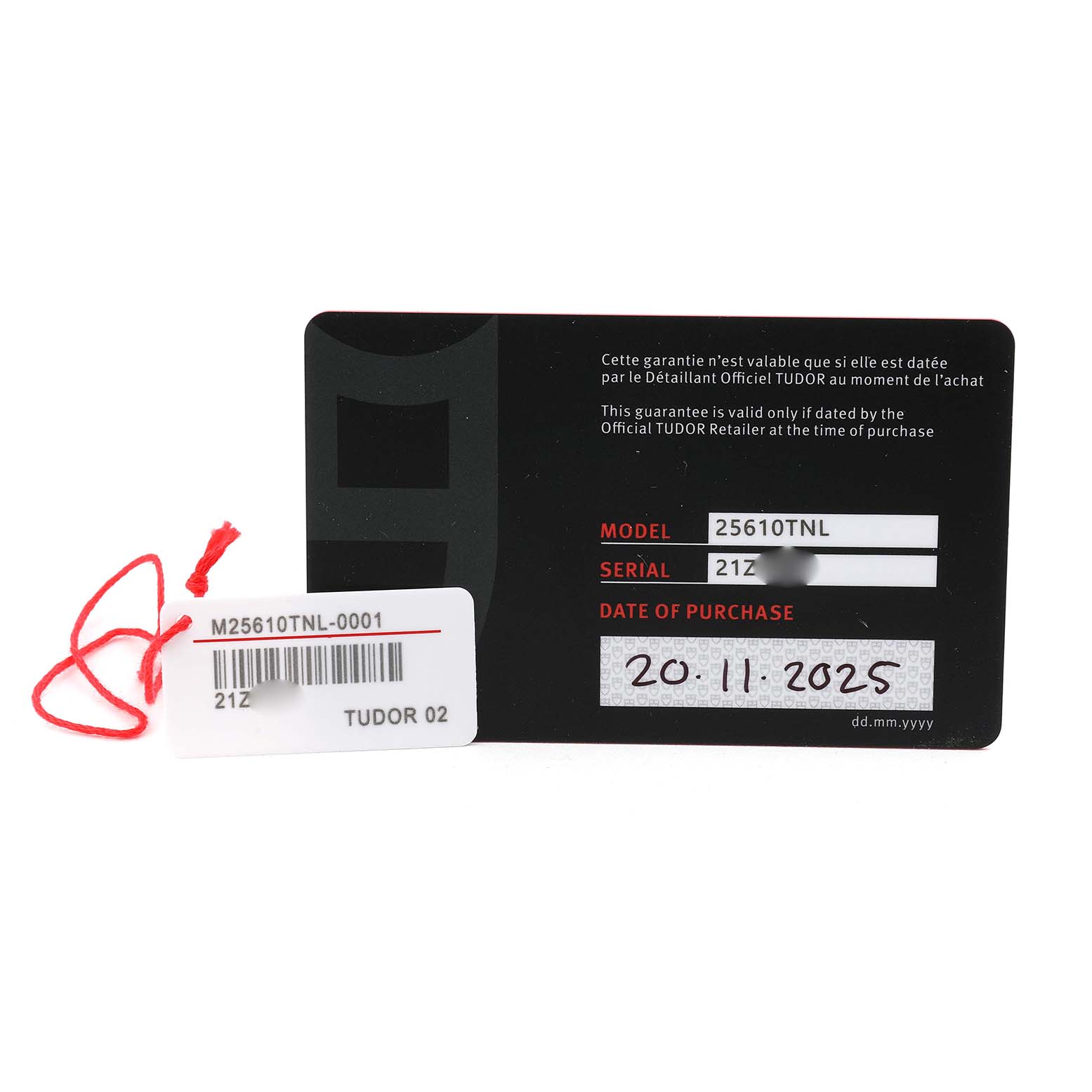 This image shows a warranty card and a tag for the Tudor Pelagos M25610TNL Men's Titanium Black Dial, highlighting the model, serial number, and purchase date.