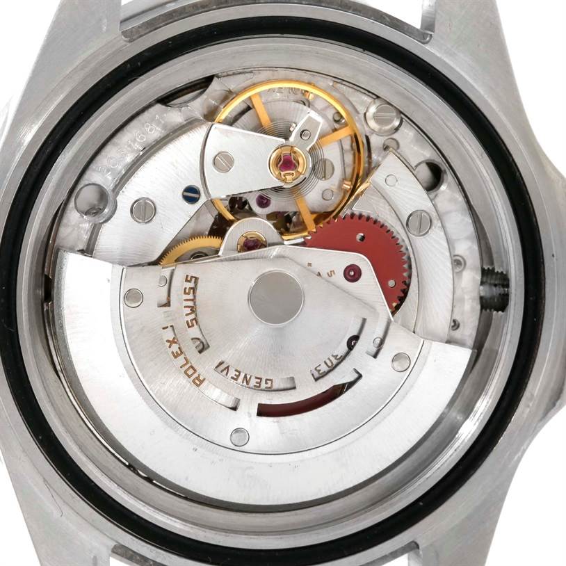 The image shows an up-close view of the movement mechanism inside the case back of a Rolex Submariner 168000 Men
s Stainless Steel Black Dial 168000 Men
s Stainless Steel Black Dial watch.
