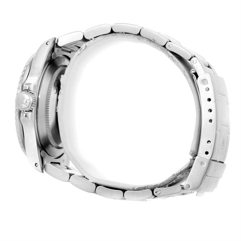 The image shows a side view of a Rolex Submariner 168000 Men
s Stainless Steel Black Dial 168000 Men
s Stainless Steel Black Dial watch, highlighting its bracelet, clasp, and side crown.