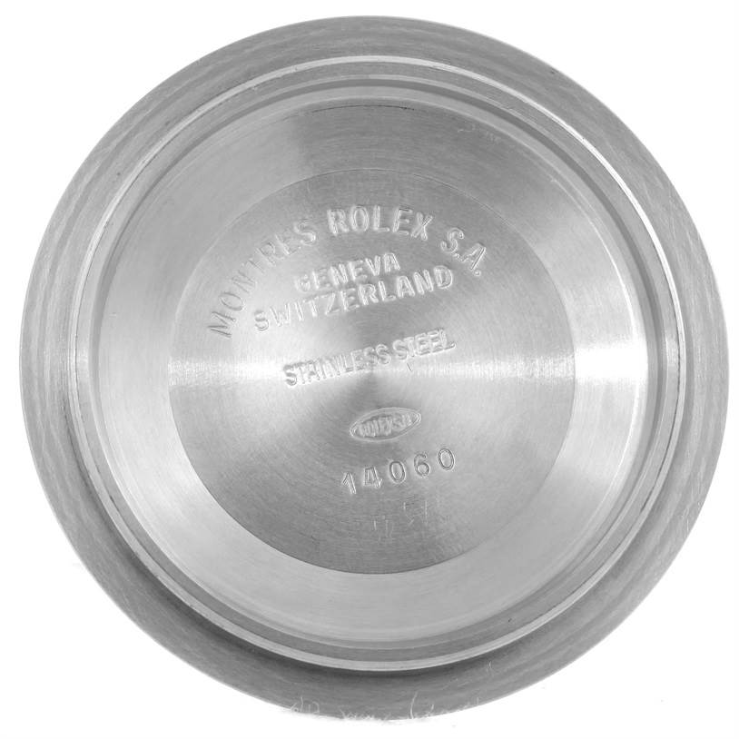 The image shows the interior case back of a Rolex Submariner 14060 Men
s Stainless Steel Black Dial 14060 Men
s Stainless Steel Black Dial watch, showcasing model details and brand engraving.