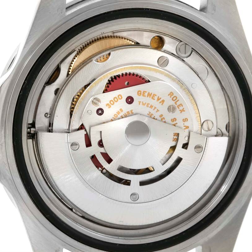 This image shows the intricate internal mechanism and movement, specifically the rotor, of a Rolex Submariner 14060 Men
s Stainless Steel Black Dial 14060 Men
s Stainless Steel Black Dial watch.