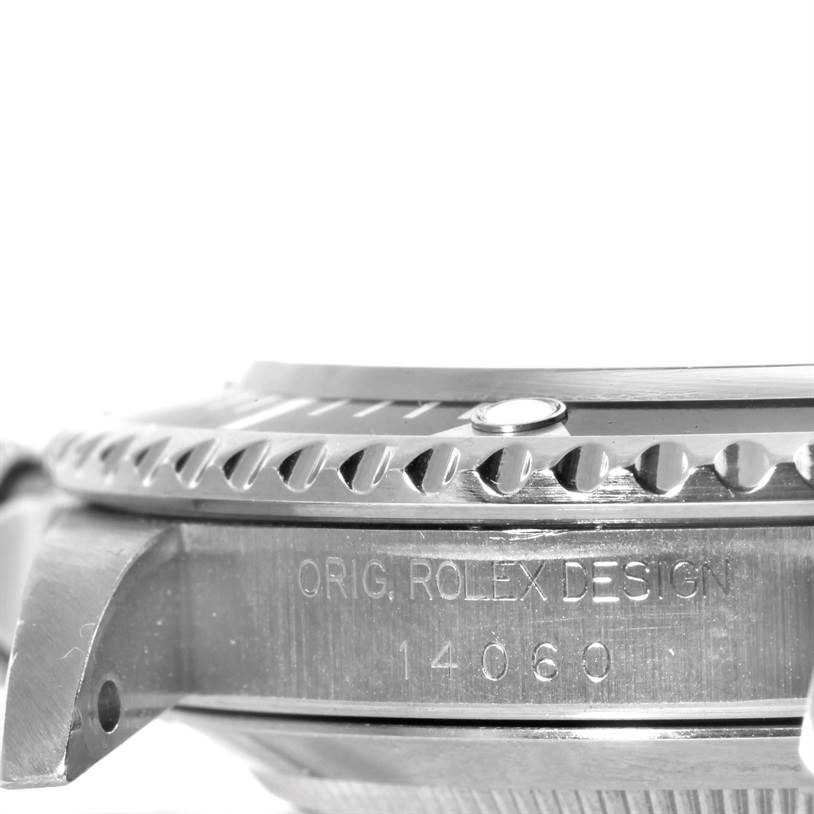 This image shows a close-up side profile of the bezel and case of a Rolex Submariner 14060 Men
s Stainless Steel Black Dial 14060 Men
s Stainless Steel Black Dial watch, including the engraved model number.
