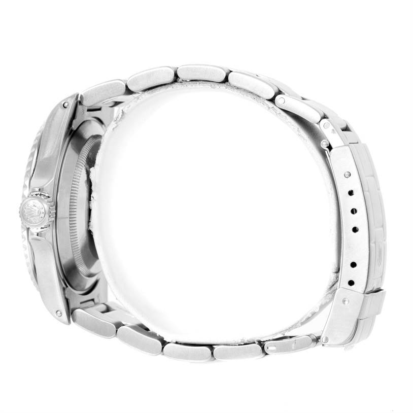 The image shows a side view of a Rolex Submariner 14060 Men
s Stainless Steel Black Dial 14060 Men
s Stainless Steel Black Dial watch focusing on the case, crown, and bracelet.