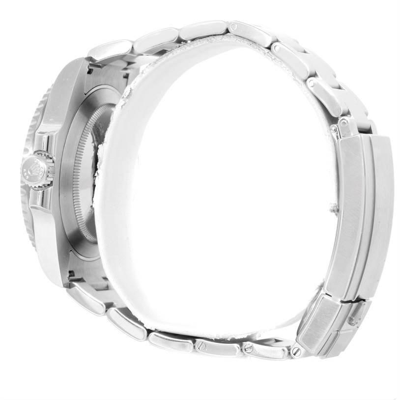 The image shows a side view of the Rolex Submariner 114060 Men
s Stainless Steel Black Dial 114060 Men
s Stainless Steel Black Dial watch, highlighting its crown, case, and metal bracelet.