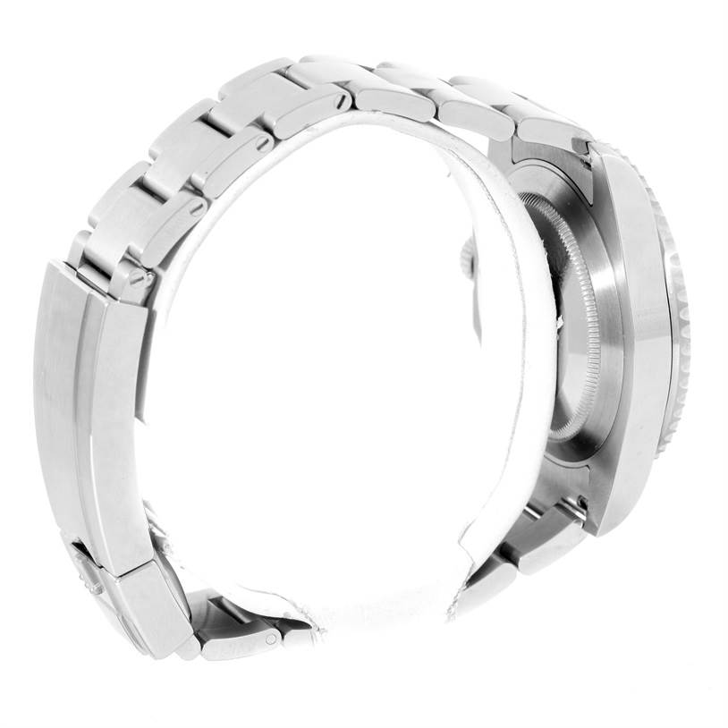 This side-angle view of a Rolex Submariner 114060 Men
s Stainless Steel Black Dial 114060 Men
s Stainless Steel Black Dial watch shows the bracelet and the case with the crown partially visible.