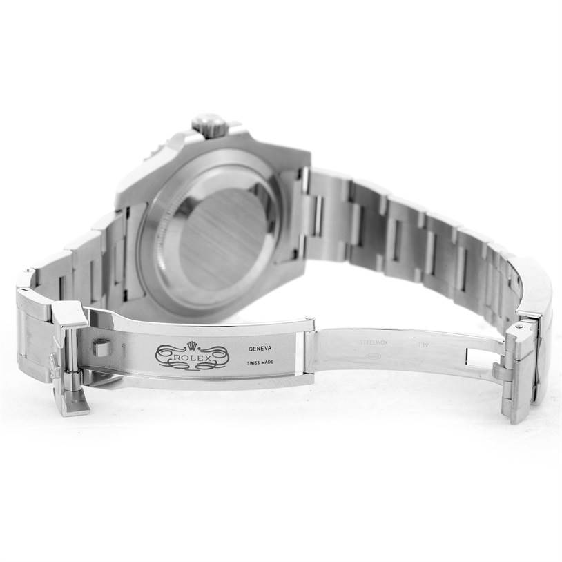 The image shows the open back case and clasp of a Rolex Submariner 116610LV Men's Stainless Steel Green Dial 116610LV Men's Stainless Steel Green Dial watch, highlighting its bracelet and inner engraving.