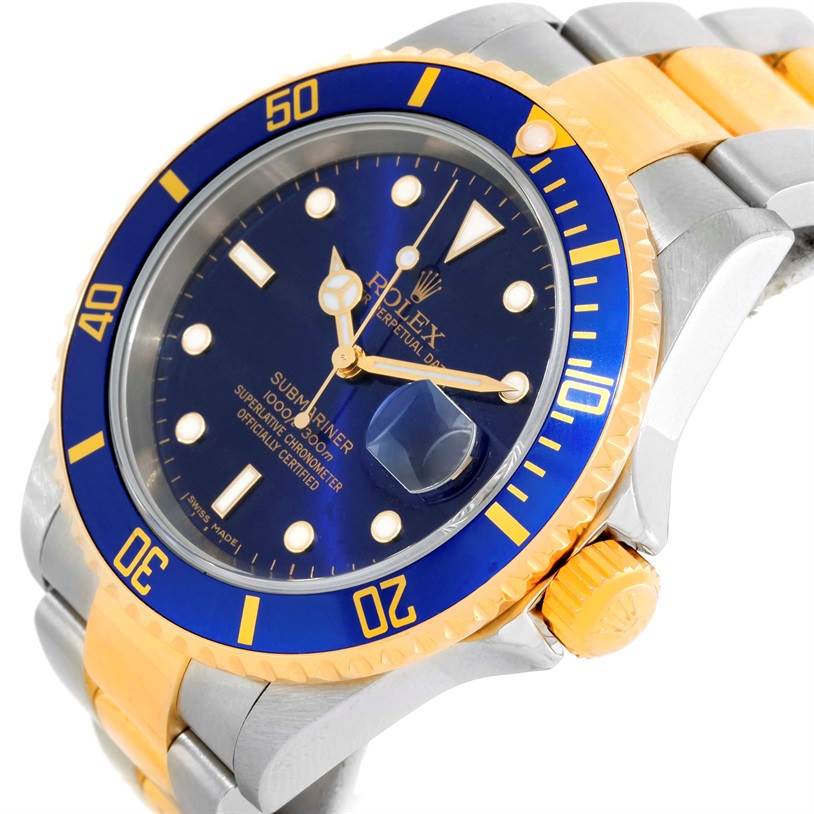 The image shows a close-up, angled view of a Rolex Submariner 16613 Men
s Steel and Gold (two tone) Blue Dial 16613 Men
s Steel and Gold (two tone) Blue Dial watch, highlighting the bezel, dial, crown, and part of the bracelet.