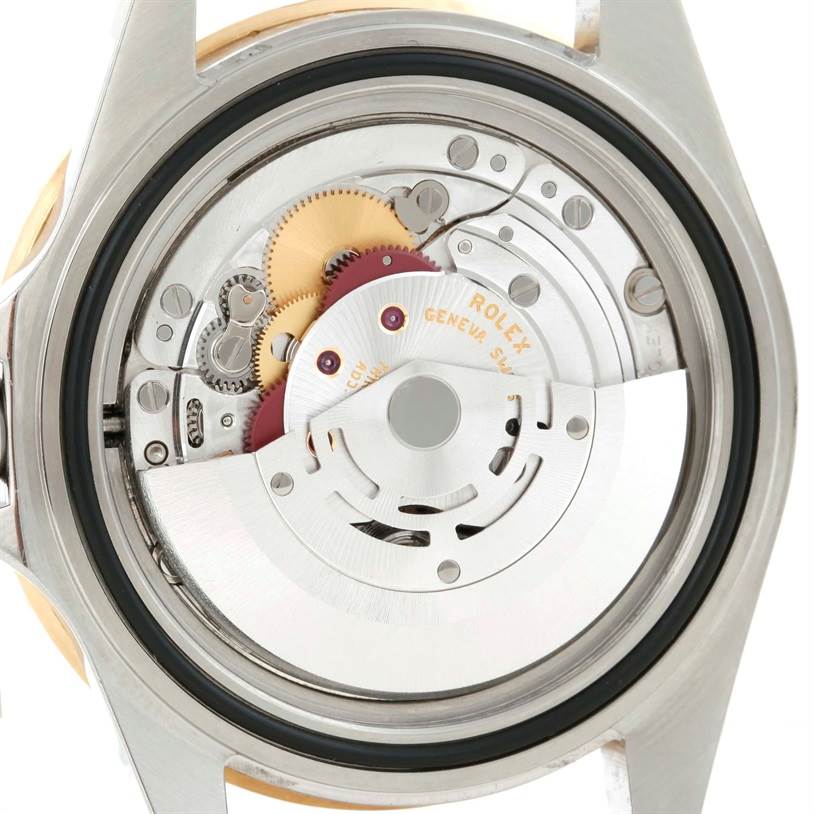 This image shows the back view of a Rolex Submariner 16613 Men
s Steel and Gold (two tone) Blue Dial 16613 Men
s Steel and Gold (two tone) Blue Dial watch, focusing on its intricate internal movement mechanism.