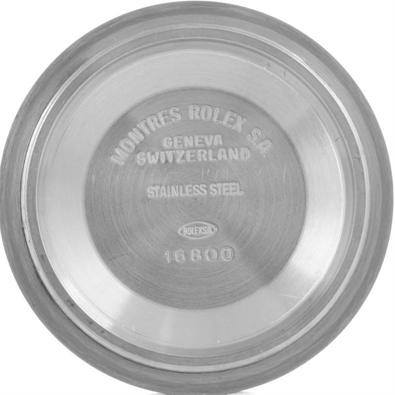 The image shows the stainless steel case back of a Rolex Submariner 168000 Men
s Stainless Steel Black Dial 168000 Men
s Stainless Steel Black Dial model 16800.