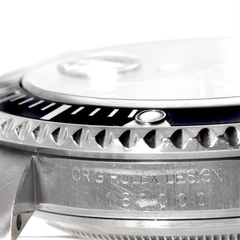 The image shows a close-up of the side profile of a Rolex Submariner 168000 Men
s Stainless Steel Black Dial 168000 Men
s Stainless Steel Black Dial, highlighting the bezel and case with "ORIG ROLEX DESIGN" engraving.