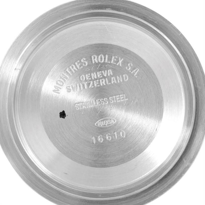 This image shows the interior case back of a Rolex Submariner 16610 Men
s Stainless Steel Black Dial 16610 Men
s Stainless Steel Black Dial, displaying the brand inscription and model number.