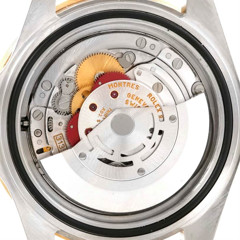 This is the back view of a Rolex Submariner 16613 Men's Steel and Gold (two tone) Blue Dial 16613 Men's Steel and Gold (two tone) Blue Dial, showing the intricate internal mechanical components and movement.
