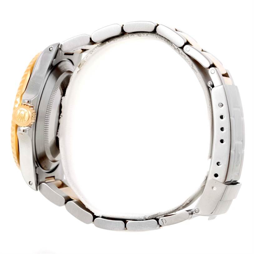 This image shows a side view of a Rolex Submariner 16613 Men's Steel and Gold (two tone) Blue Dial 16613 Men's Steel and Gold (two tone) Blue Dial watch, highlighting the crown, case, and bracelet.