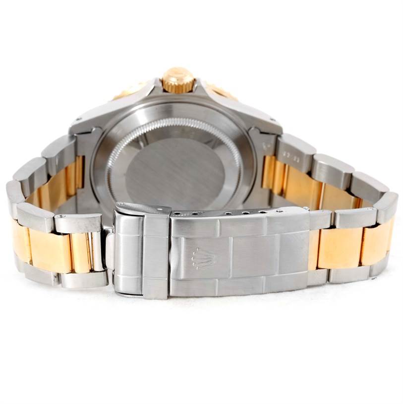 This image shows the backside and clasp of a Rolex Submariner 16613 Men's Steel and Gold (two tone) Blue Dial 16613 Men's Steel and Gold (two tone) Blue Dial, highlighting the two-tone bracelet and the case back.