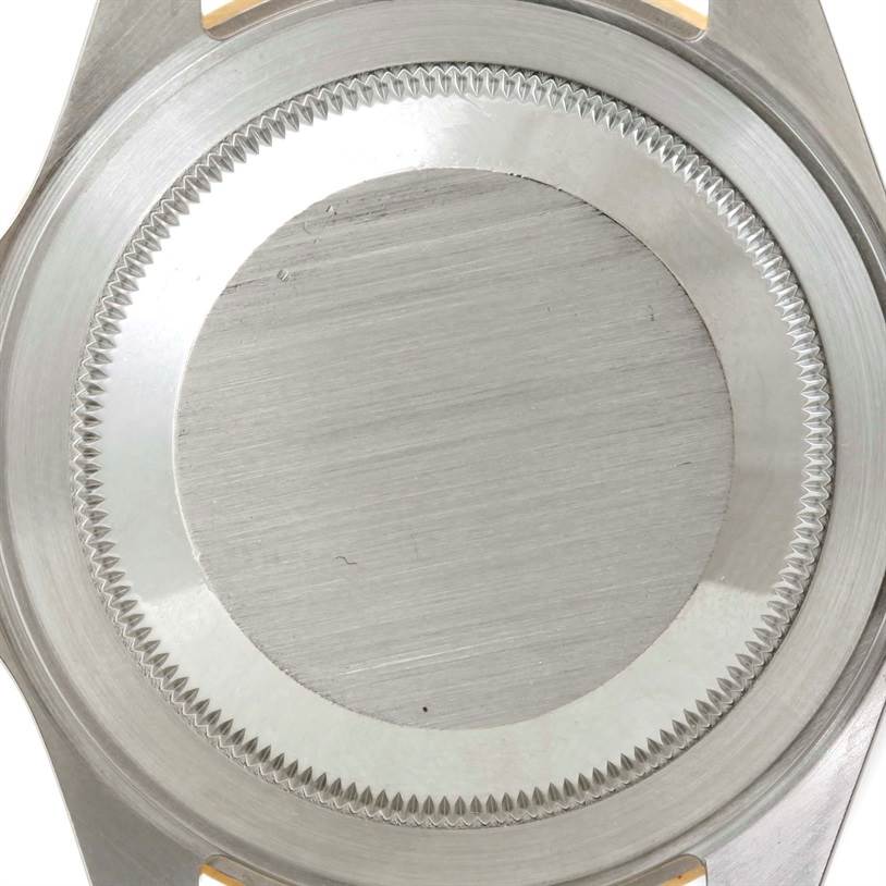 This image shows the case back of a Rolex Submariner 16613 Men's Steel and Gold (two tone) Blue Dial 16613 Men's Steel and Gold (two tone) Blue Dial watch, viewed from the rear.