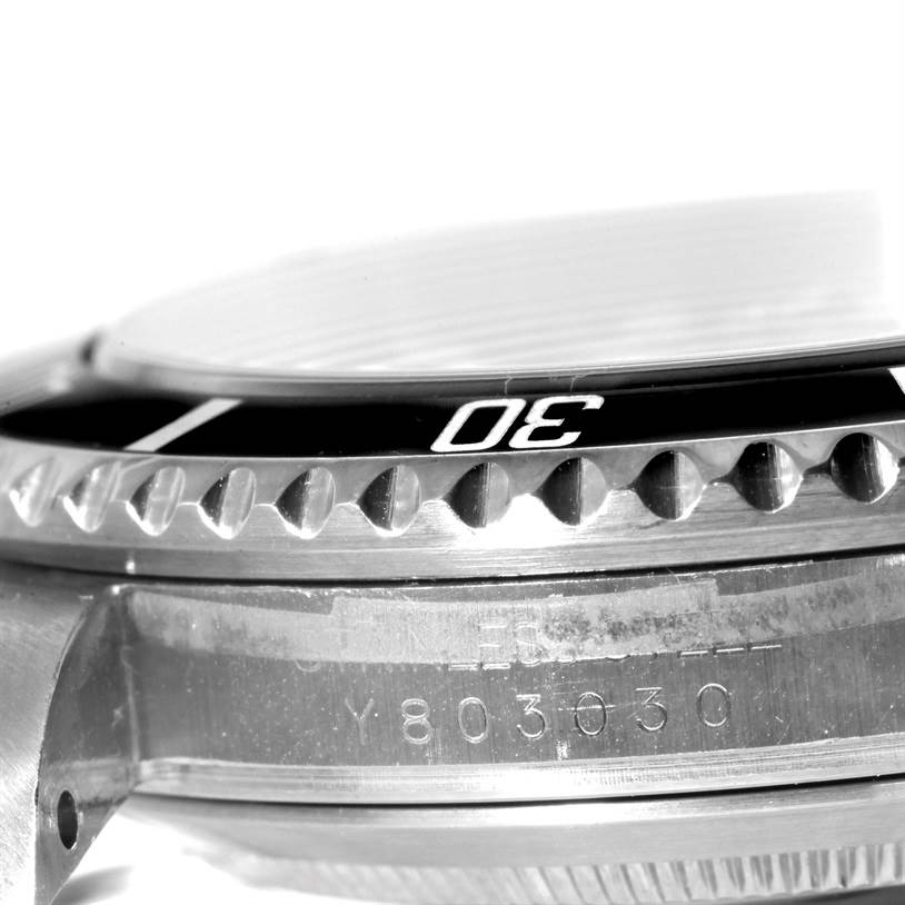 This image shows a close-up side angle of the bezel and case of a Rolex Submariner 16610 Men
s Stainless Steel Black Dial 16610 Men
s Stainless Steel Black Dial watch.