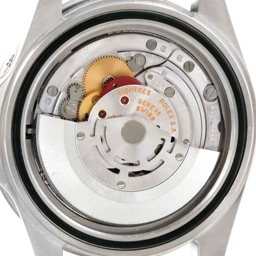 This is an interior view of the Rolex Submariner 16610 Men
s Stainless Steel Black Dial 16610 Men
s Stainless Steel Black Dial model, showcasing its intricate movement and gears.