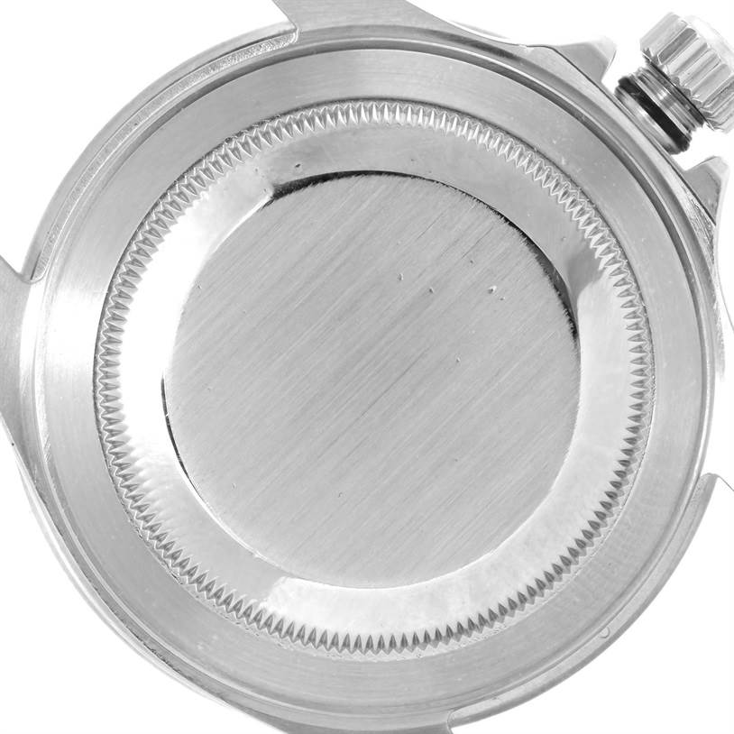 This image shows the back casing and crown of a Rolex Submariner 16610 Men
s Stainless Steel Black Dial 16610 Men
s Stainless Steel Black Dial watch from a top-down angle.