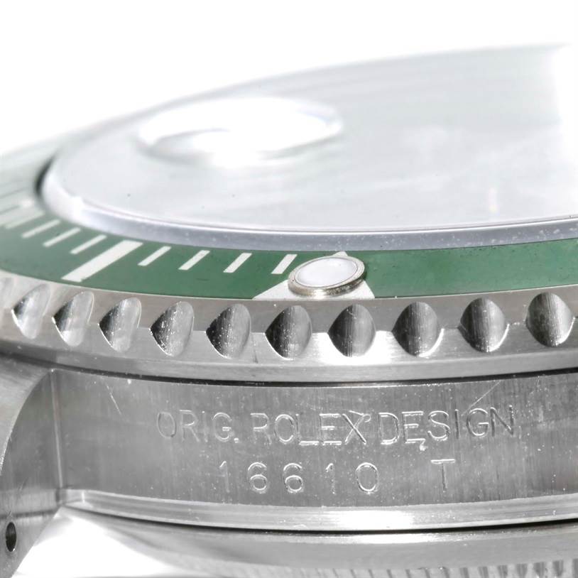 The close-up image shows the side profile of a Rolex Submariner 16610LV Men
s Stainless Steel Black Dial 16610LV Men
s Stainless Steel Black Dial, highlighting the bezel, green insert, and engraved details on the case.