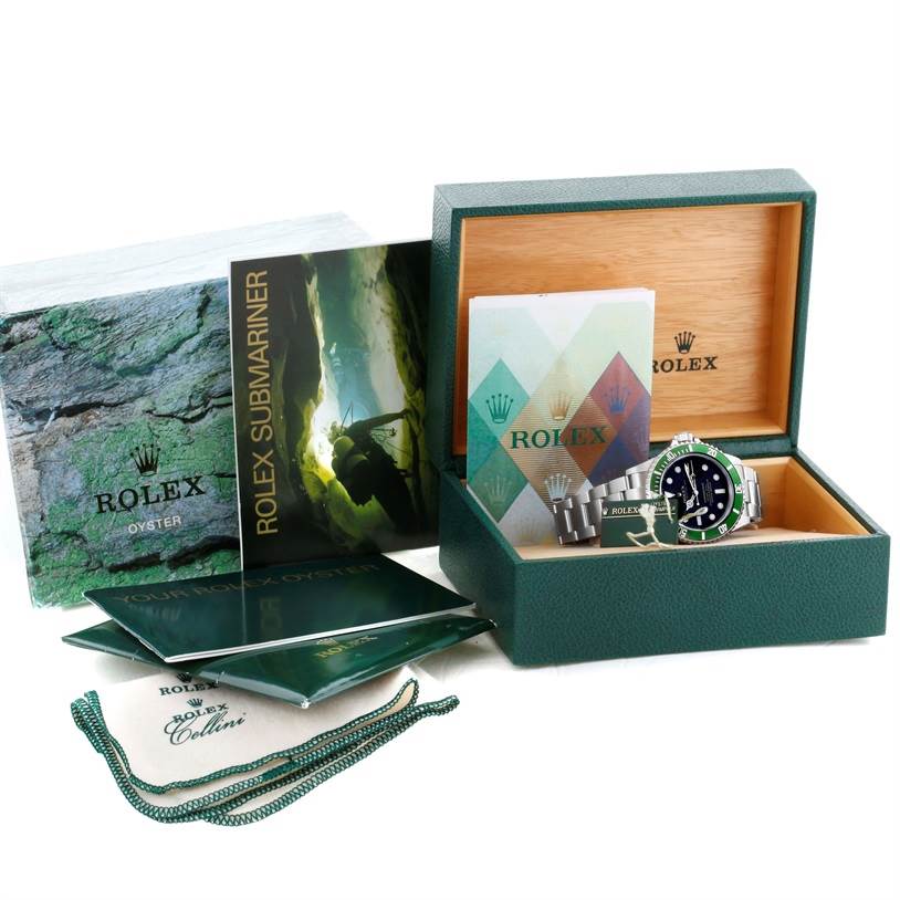 This image shows the Rolex Submariner 16610LV Men
s Stainless Steel Black Dial 16610LV Men
s Stainless Steel Black Dial watch with its open box, booklet, warranty, and accessories.