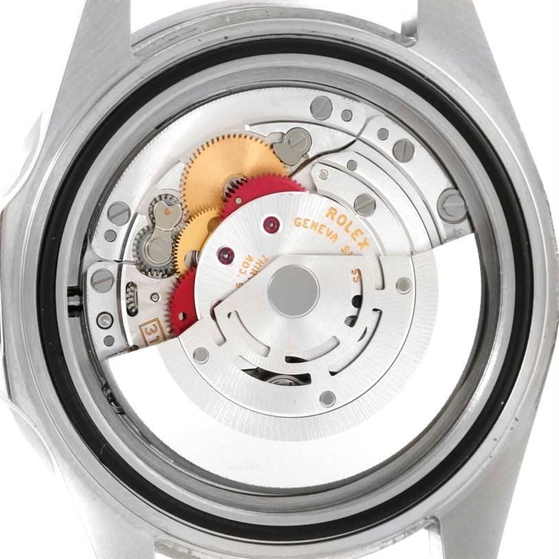 The image shows the internal mechanical movement of a Rolex Submariner 16610 Men
s Stainless Steel Black Dial 16610 Men
s Stainless Steel Black Dial watch, viewed from the back.