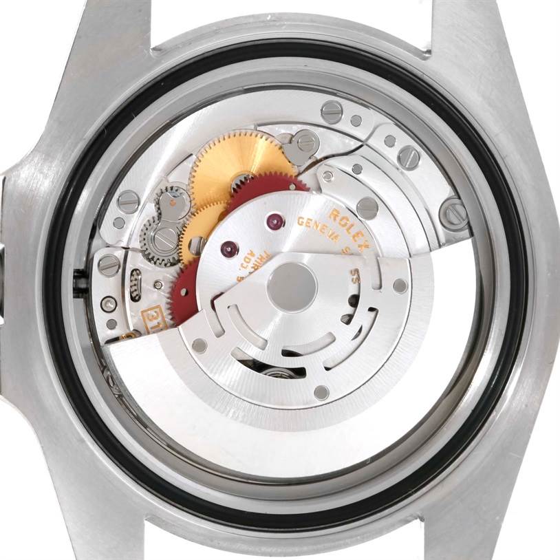 The image shows the internal mechanical movement of a Rolex Submariner 116610 Men
s Stainless Steel Black Dial 116610 Men
s Stainless Steel Black Dial watch from the back angle, highlighting gears and the rotor.