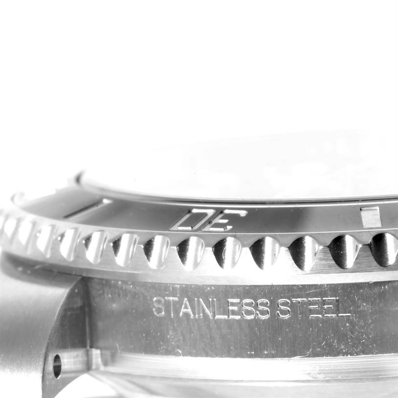 This image shows a close-up side view of the bezel and case of a Rolex Submariner 116610 Men
s Stainless Steel Black Dial 116610 Men
s Stainless Steel Black Dial watch, highlighting the "STAINLESS STEEL" inscription.