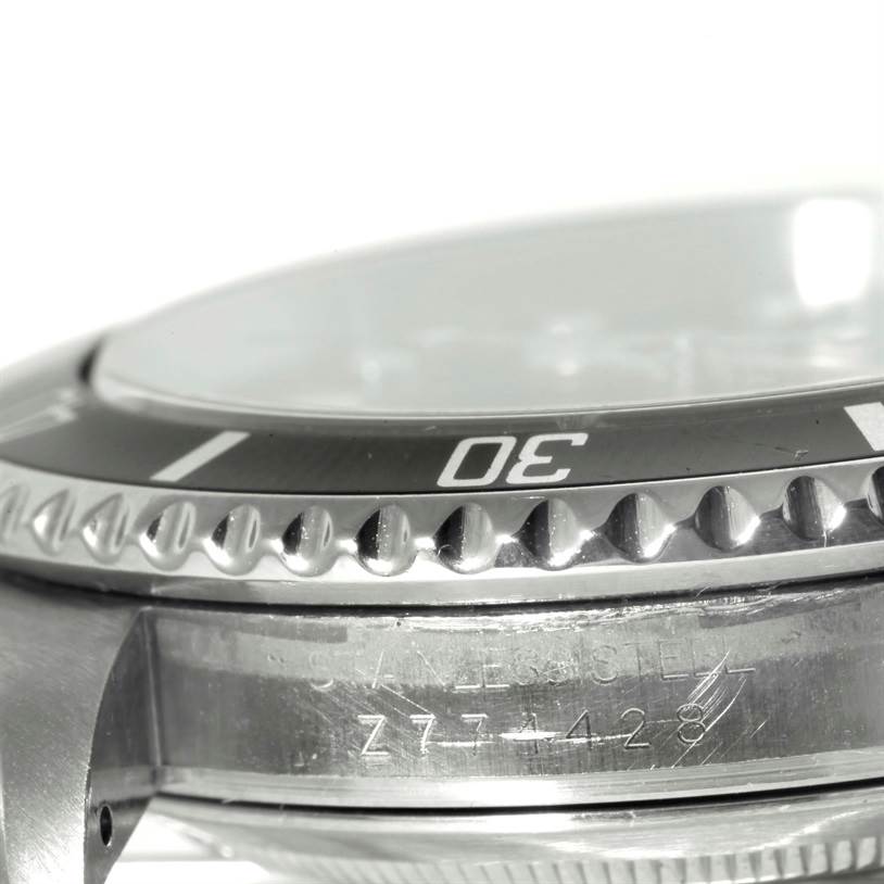 This close-up image shows the bezel, crystal, and case side of a Rolex Submariner 16610 Men
s Stainless Steel Black Dial 16610 Men
s Stainless Steel Black Dial watch.