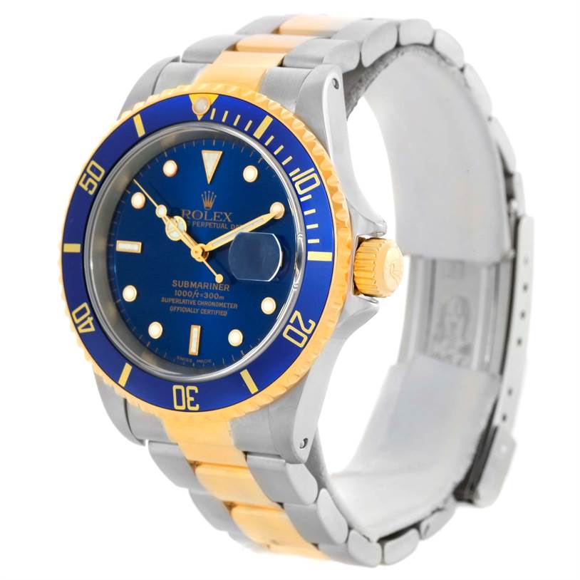The Rolex Submariner 16613 Men's Steel and Gold (two tone) Blue Dial 16613 Men's Steel and Gold (two tone) Blue Dial watch is shown at a three-quarter angle, displaying its blue dial, bezel, crown, and two-tone bracelet.