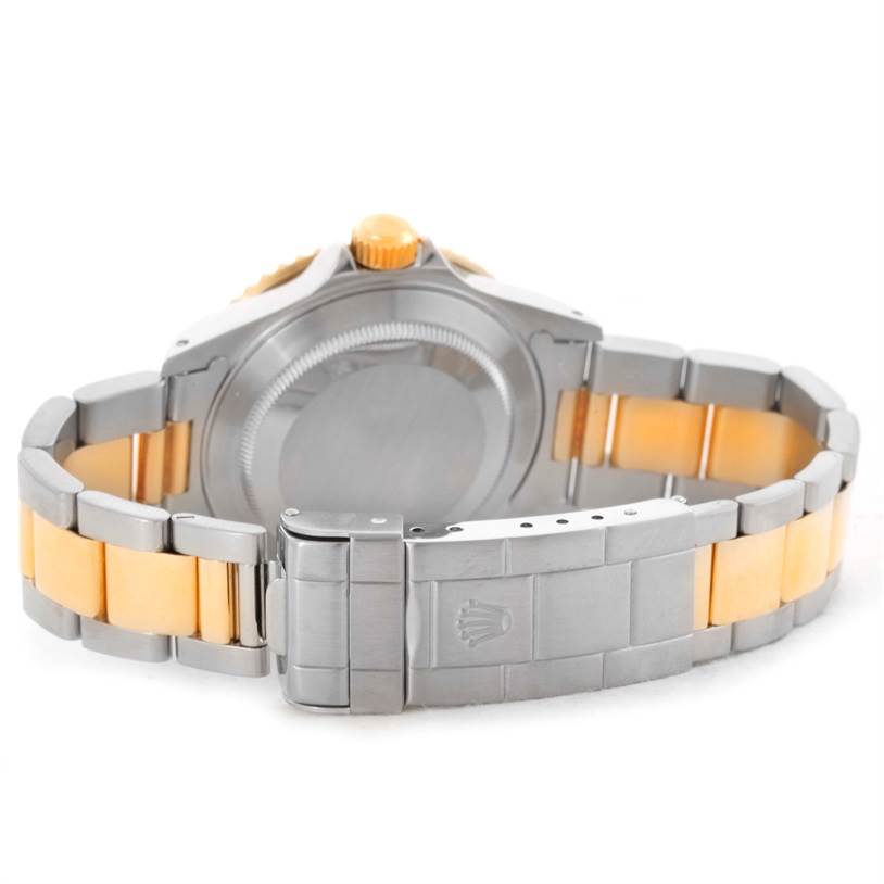 The image shows the back case and bracelet clasp of a Rolex Submariner 16613 Men's Steel and Gold (two tone) Blue Dial 16613 Men's Steel and Gold (two tone) Blue Dial watch.