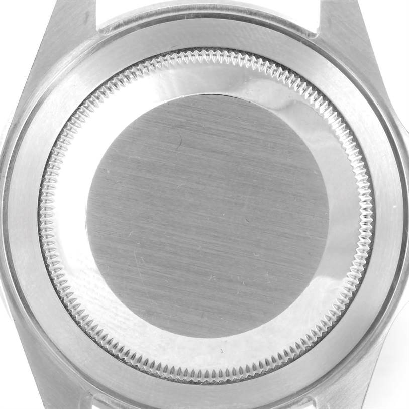 The image shows the back case of a Rolex Submariner 16610 Men
s Stainless Steel Black Dial 16610 Men
s Stainless Steel Black Dial watch, viewed from a top-down angle.