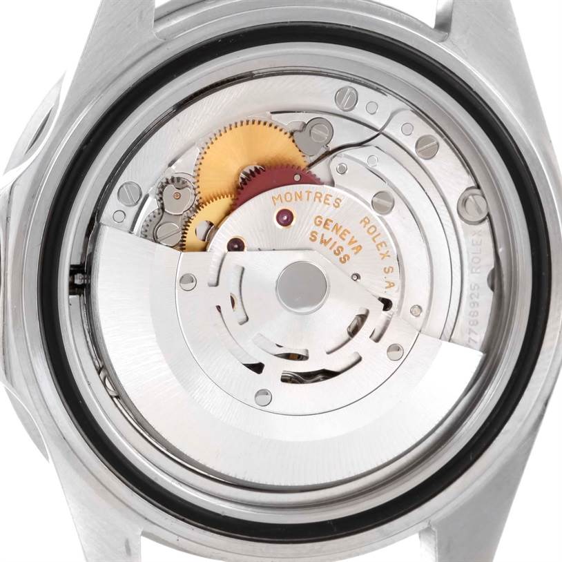 The image shows the back view of the Rolex Submariner 16610 Men
s Stainless Steel Black Dial 16610 Men
s Stainless Steel Black Dial, highlighting its intricate movement and internal mechanism.