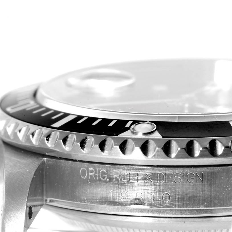 This image shows a close-up side view of the bezel and engraved side of the Rolex Submariner 16610 Men
s Stainless Steel Black Dial 16610 Men
s Stainless Steel Black Dial watch.