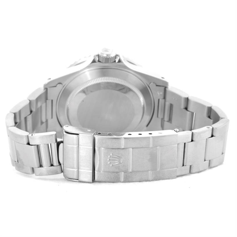 The image shows the back view of a Rolex Submariner 16610 Men
s Stainless Steel Black Dial 16610 Men
s Stainless Steel Black Dial watch, focusing on the case back and the metal bracelet with the clasp.