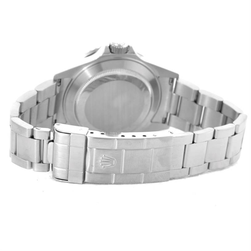 The image shows the back of a Rolex Submariner 16610 Men
s Stainless Steel Black Dial 16610 Men
s Stainless Steel Black Dial watch, highlighting its closed case back and bracelet clasp.